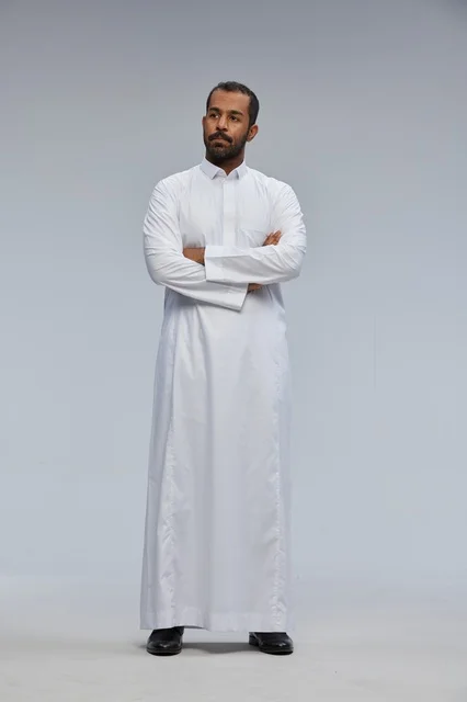 Saudi Man in White Thobe with Arms Crossed