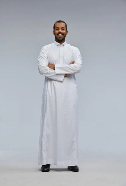 Saudi Man in Traditional White Thobe Standing in Studio