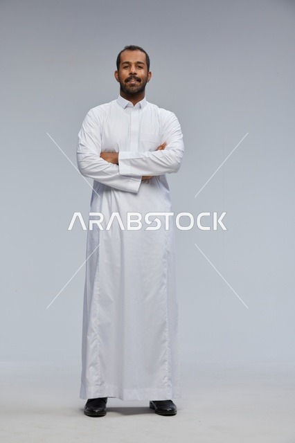 Saudi Man in White Thobe with Arms Crossed in Studio