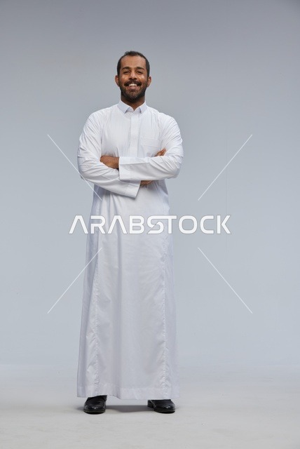 Saudi Man in White Thobe Standing Studio Portrait