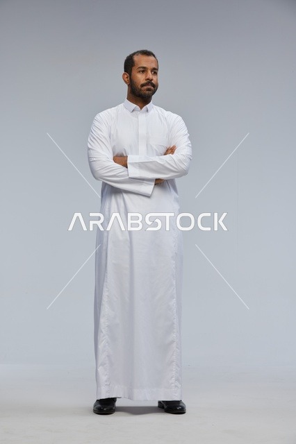 Saudi Man in White Thobe Standing in Studio