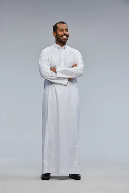 Saudi Man in White Thobe with Arms Crossed Studio Shot
