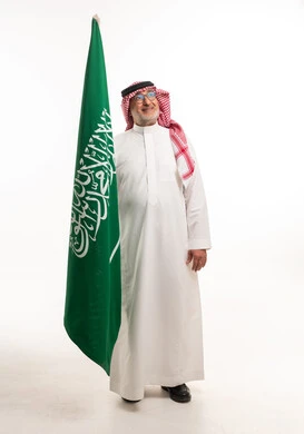 Saudi Man with National Flag on White Background