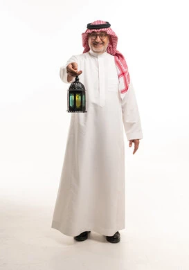 Senior Saudi Man with Ramadan Lantern on White Background
