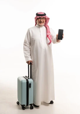 Saudi Man with Suitcase Holding Smartphone