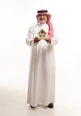 Saudi Man Holding Wooden House Model on White Background