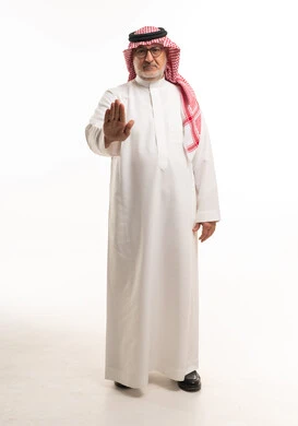 Senior Saudi Man Making Stop Gesture in Studio