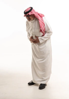 Elderly Saudi Man with Stomach Ache on White Background
