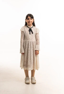 Arab Girl in White Lace Dress on Studio Background