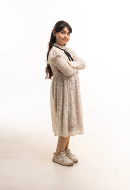 Saudi Girl in White Lace Dress on Studio Background