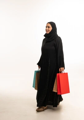 Emirati Woman with Shopping Bags in Studio