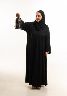 Arab Woman in Black Abaya Holding Ramadan Lantern