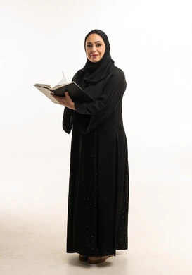 Saudi Woman in Black Abaya Holding Book