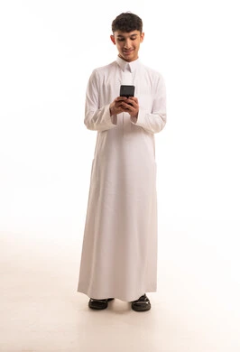Saudi Man in Thobe using Smartphone on White Background