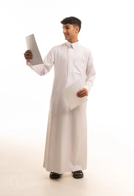 Saudi Man in Traditional White Thobe Holding Papers