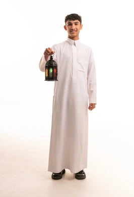Saudi Man in White Thobe Holding Ramadan Lantern