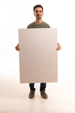 Arab Man Holding Large Blank White Board in Studio