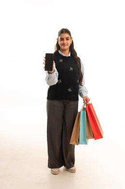 Arab Woman Holding Shopping Bags and Smartphone
