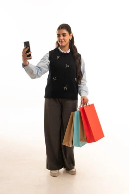 Saudi Woman with Shopping Bags Taking a Selfie