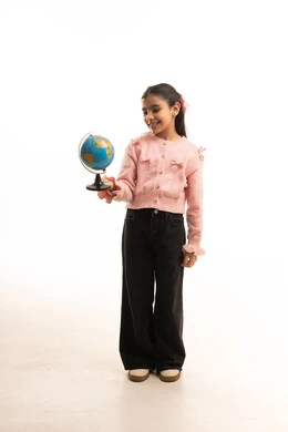 Saudi Girl Holding Globe in Studio on White Background