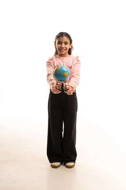 Saudi Girl Holding World Globe in Studio