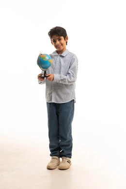Arab Boy Holding Desk Globe on Plain White Background