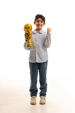 Saudi Boy Holding World Cup Trophy on White Background