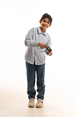 Smiling Arab Boy Holding Video Game Controller in Studio