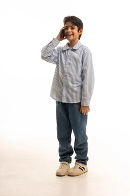 Arab Boy Talking on Smartphone in Studio