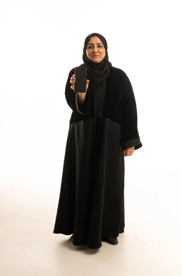 Arab Woman in Black Abaya Holding Smartphone