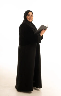 Saudi Woman in Abaya Holding Notebook Studio Shot