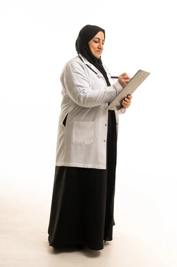 Saudi Female Doctor Writing on Clipboard in Studio