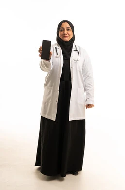 Saudi Female Doctor Holding Smartphone on White Background