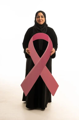 Arab Woman Holding Pink Ribbon for Breast Cancer