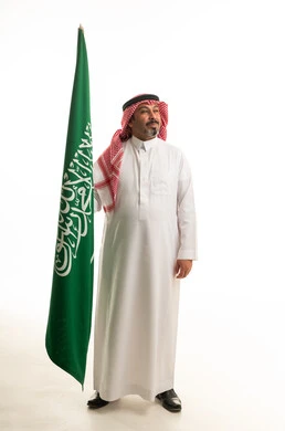 Saudi Man with National Flag on White Background