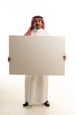 Saudi Man Holding Blank White Board in Studio
