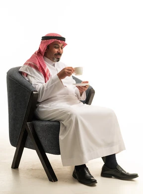 Saudi Man Drinking Coffee in Studio White Background