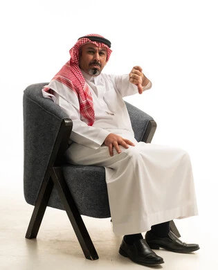 Saudi Man in Traditional Dress Giving Thumbs Down