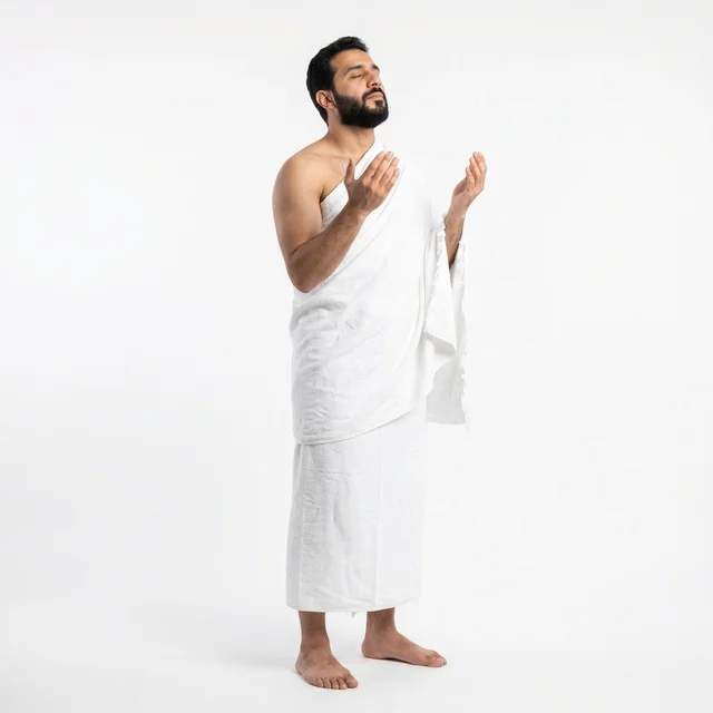 Muslim Man in Ihram Praying on White Background