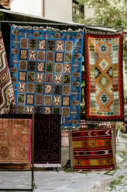 Traditional Hand-Woven Rugs in Oman Outdoor Market