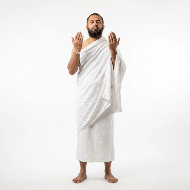 Muslim Man in White Ihram Praying on White Background