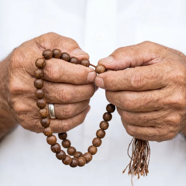 Elderly Man Hands Holding Wooden Prayer Beads