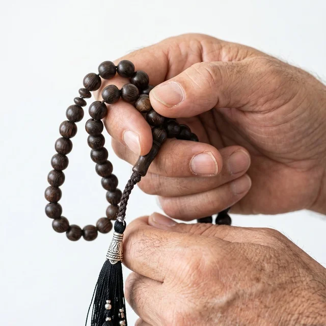 Wooden Prayer Beads in Elderly Hands Close-up
