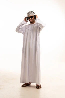 Omani Man in Traditional Dress with Headphones in Studio