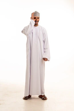Omani Man in Traditional Dishdasha and Kumma