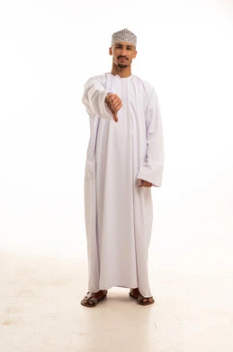 Omani Man in Traditional Dress with Thumbs Down Gesture