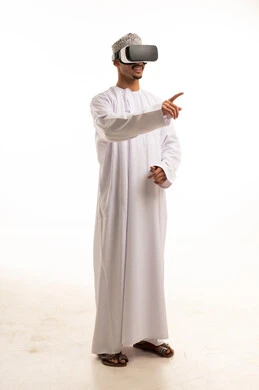 Omani Man in Traditional Dress Using VR Goggles