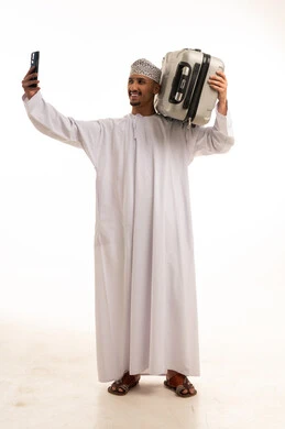 Omani Man with Suitcase Taking Selfie Studio Shot