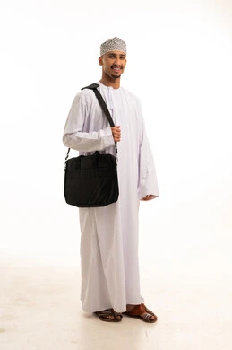 Omani Man in Traditional Dress with Laptop Bag