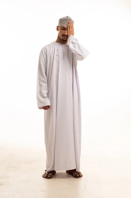 Omani Man in Traditional Dishdasha and Kumma